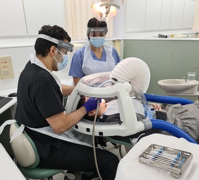 A patient undergoing a dental procedure using the Novel Patient Shield. (Image: University of Bristol Dental School)